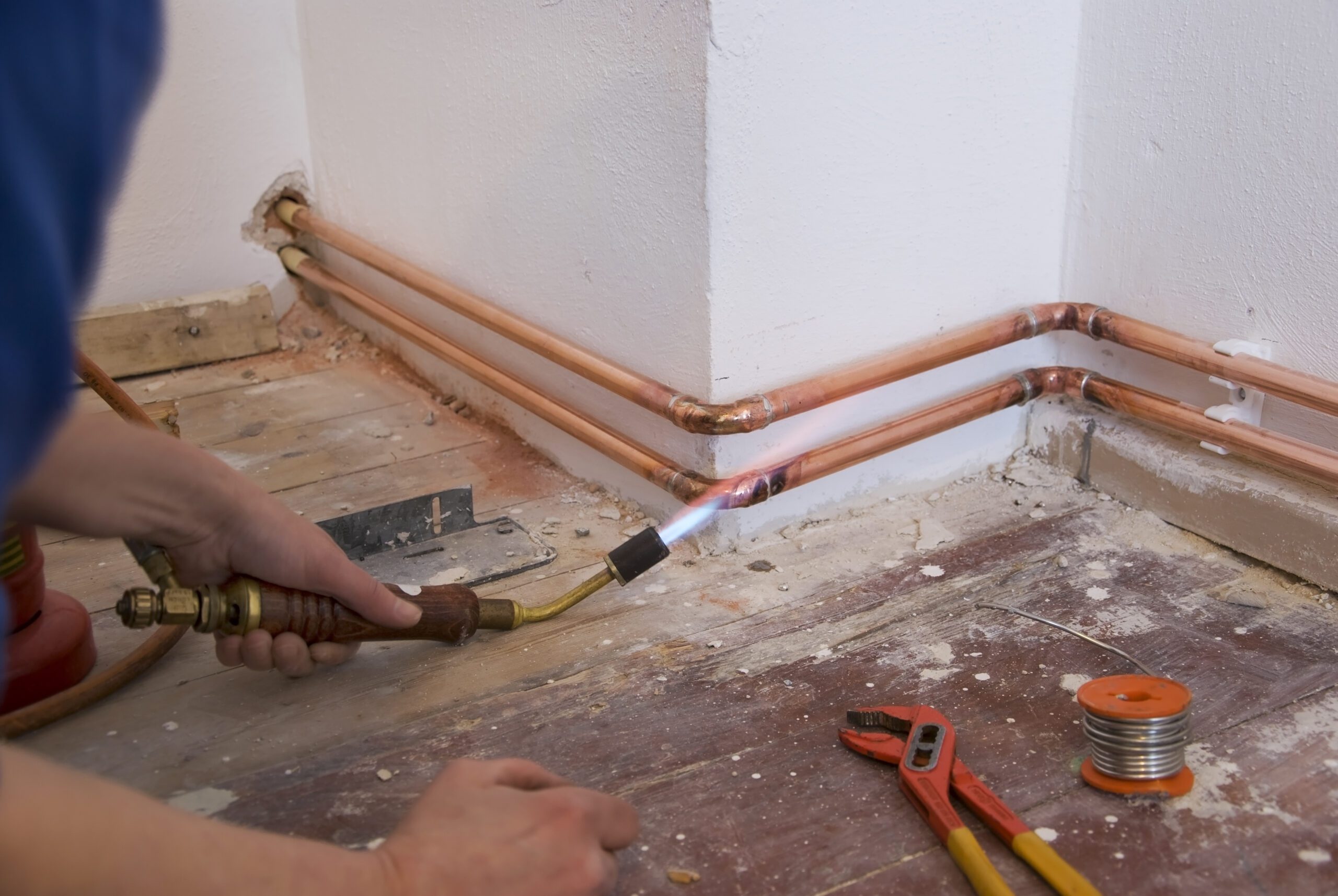 Plumber,Soldering,A,Copper,Pipe,As,Part,Of,A,Heating
